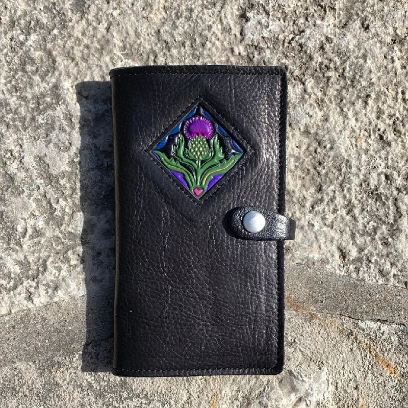 Black with thistle